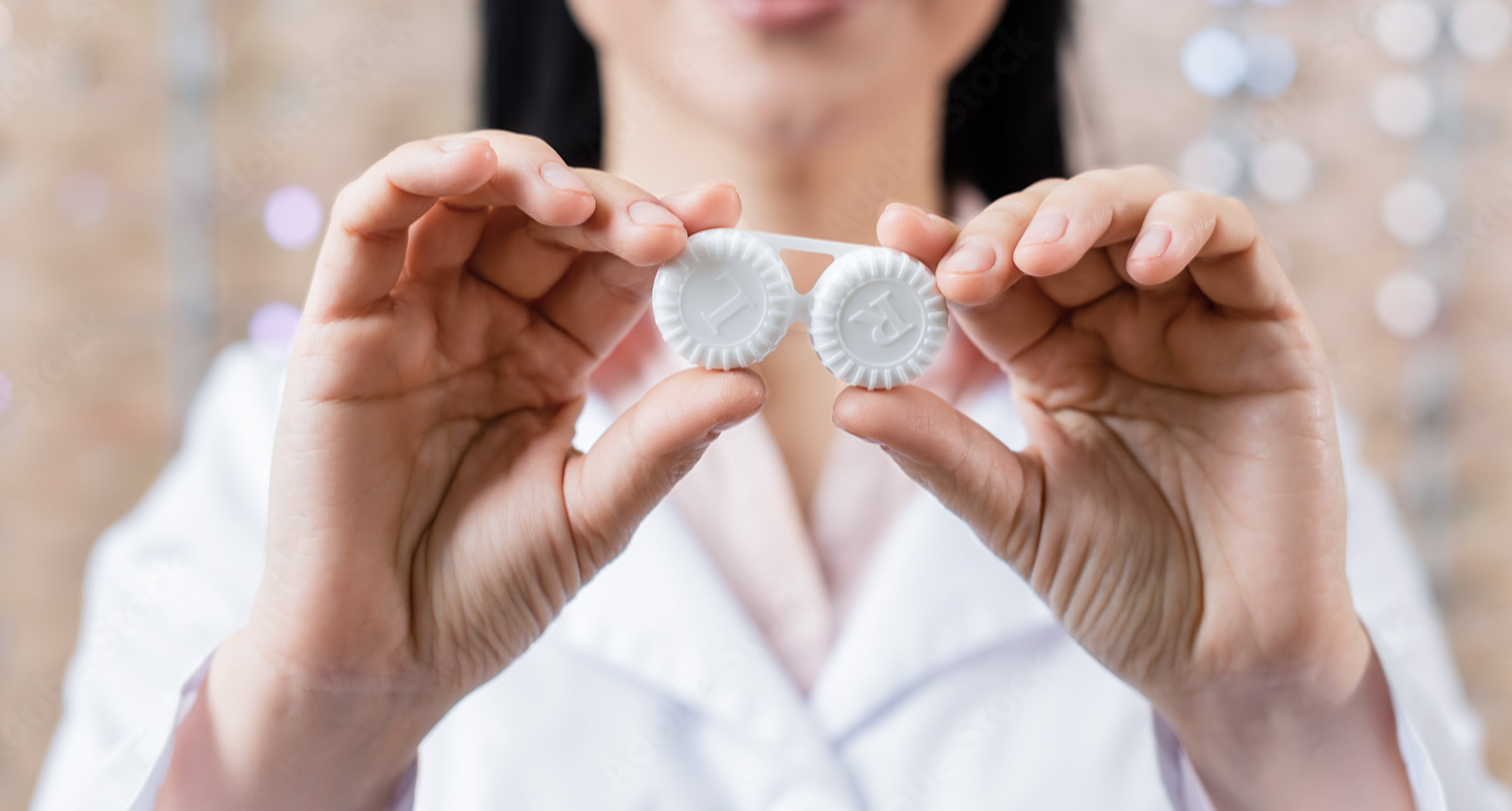 holding white contact lens case